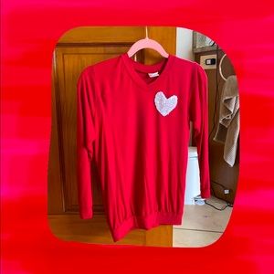 This is a cute red shirt long sleeve with a heart on the front